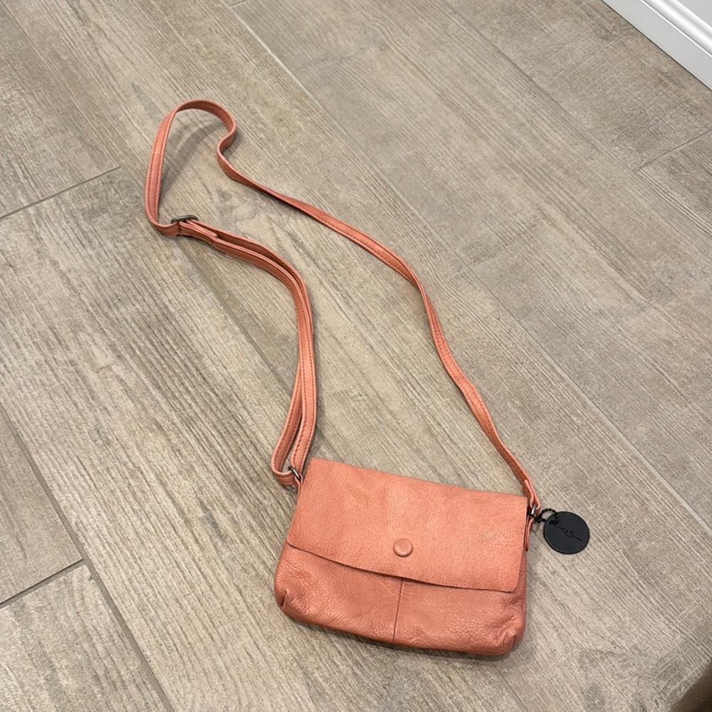 Pink Leather Crossbody Bag with Flap Closure